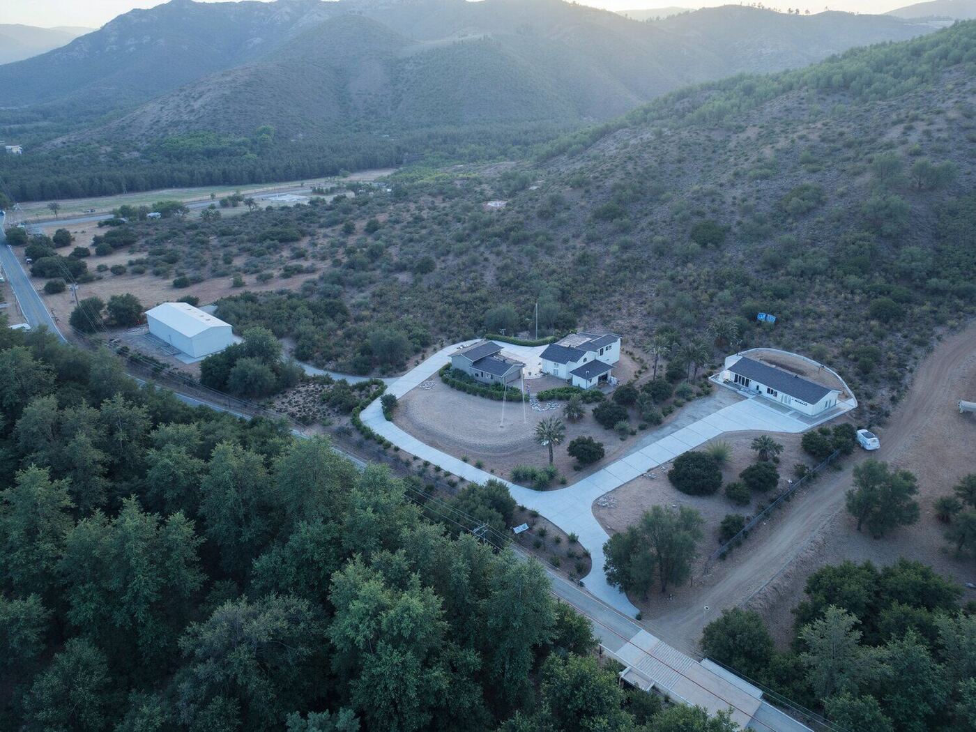 Aerial view of a protected hillside property in a valley